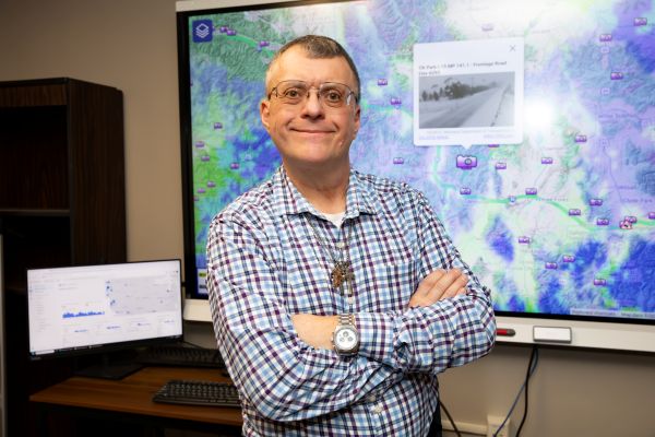 Doug Galarus in front of a smart board