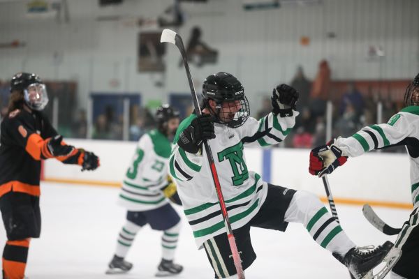 An Oredigger hockey player rejoices