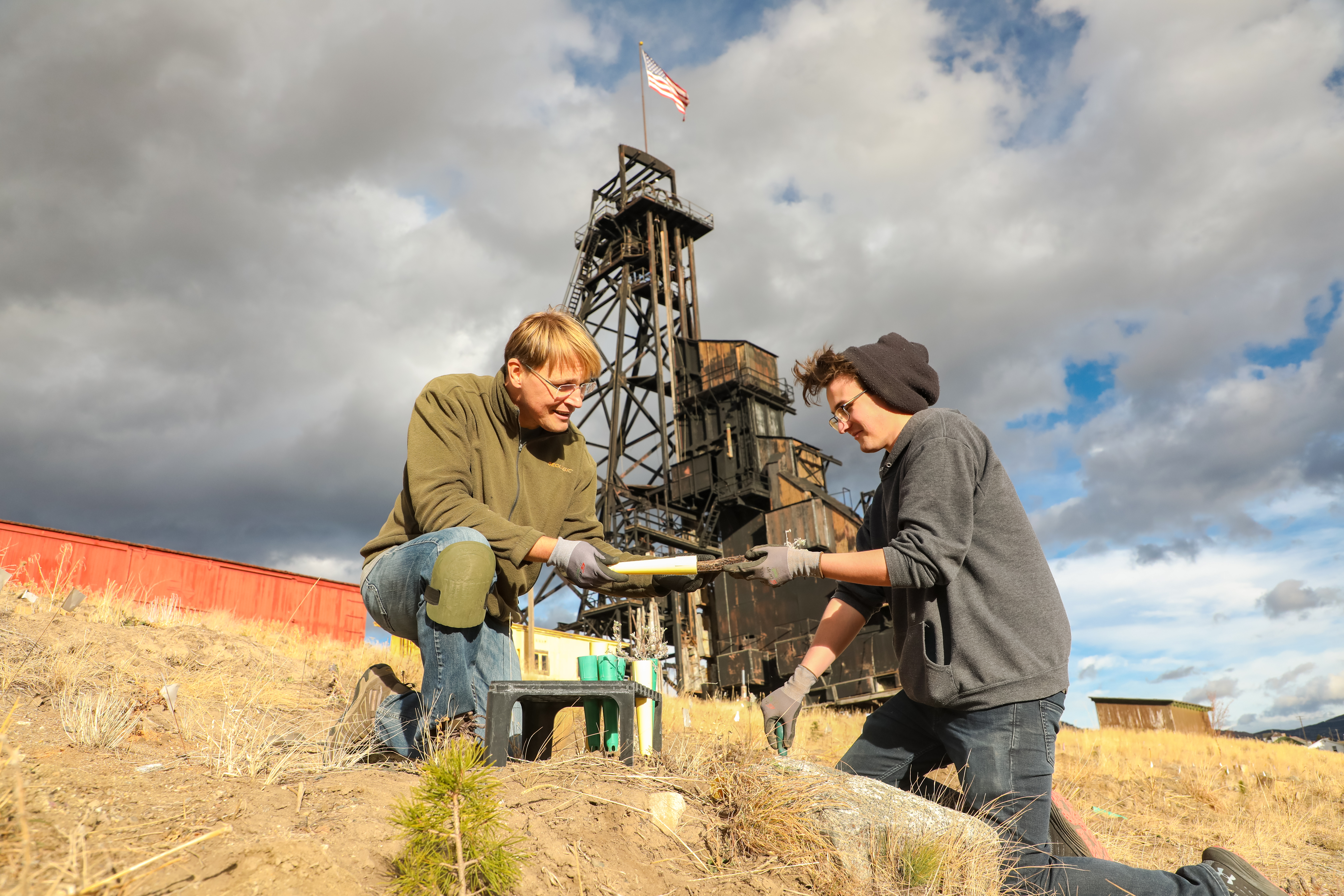 !A student assists a professor in a restoration project