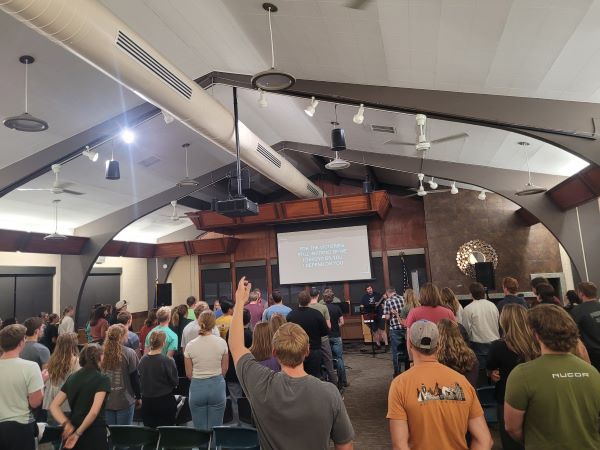 Students worship in a Chi Alpha service
