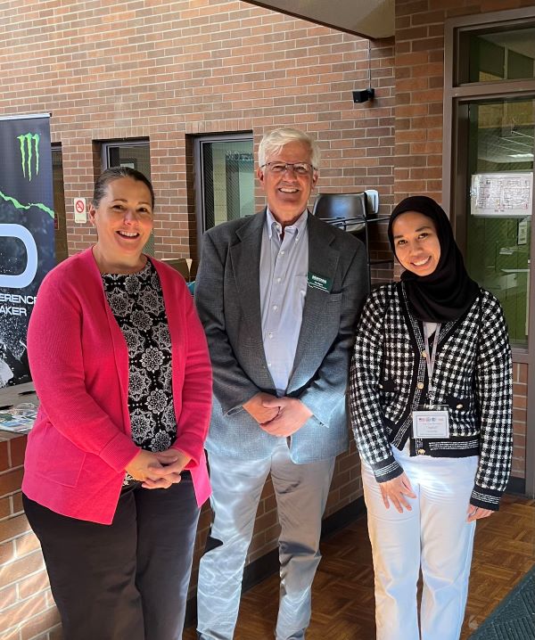 Professor Dawn Atkinson, Vice Provost Tim Elgren, and Nusrul Aqilah pose for a photo