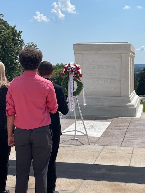 Students present a wreath